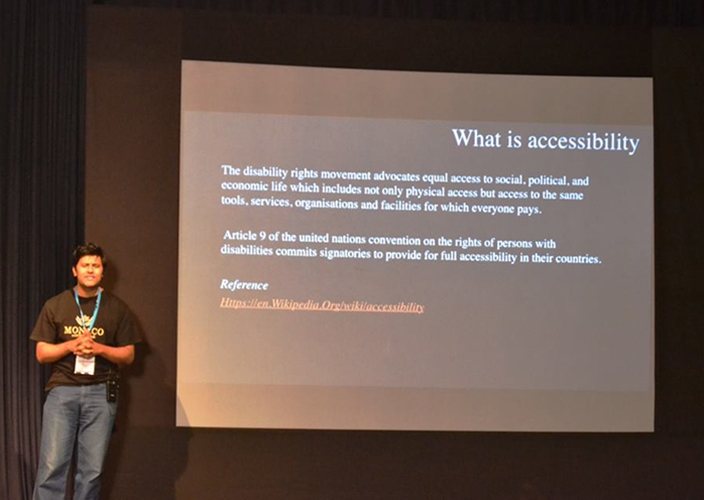 2016, Raghavendra on stage speaking at WordCamp Mumbai